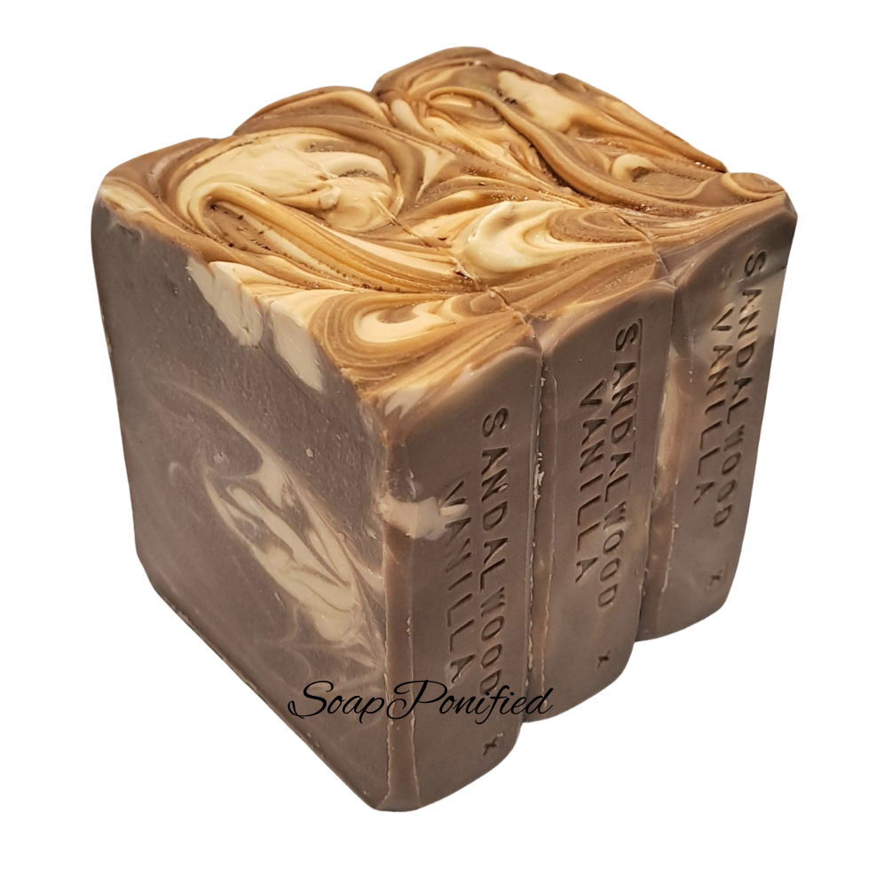 Sandalwood and Vanilla Soap Bar trio. Brown with a white swirl.